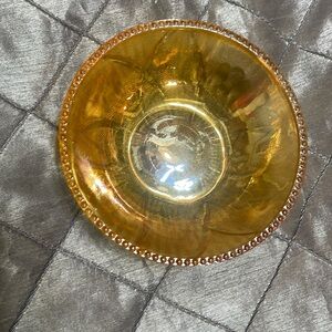 Small vintage Amber Carnival Glass Dish w/floral & hobnail pattern around rim.